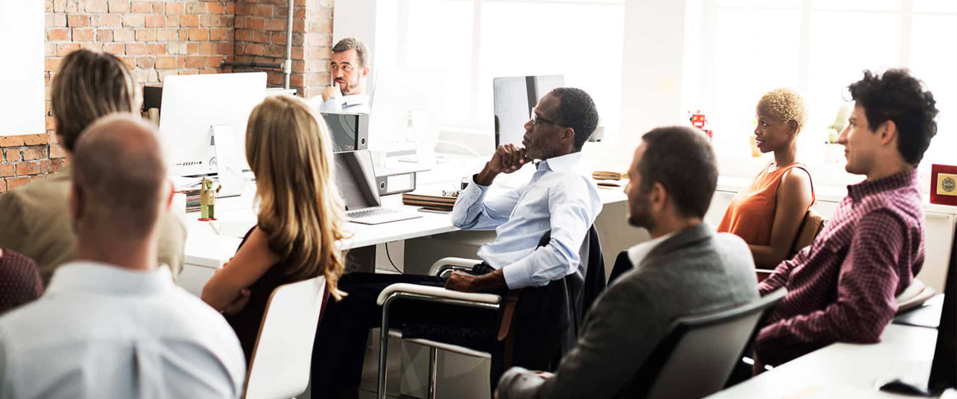 Participants attending a professional development workshop at Acamind Academy.