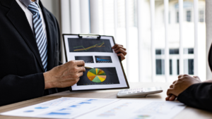 small business setting with entrepreneurs reviewing financial statements and corporate tax documents