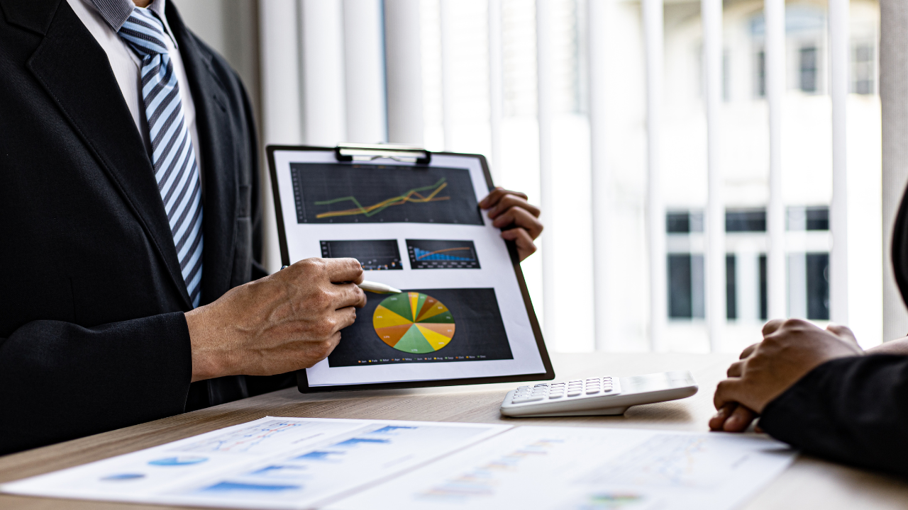 small business setting with entrepreneurs reviewing financial statements and corporate tax documents