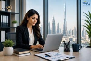 Businesswoman working on laptop at modern office with Dubai skyline view.